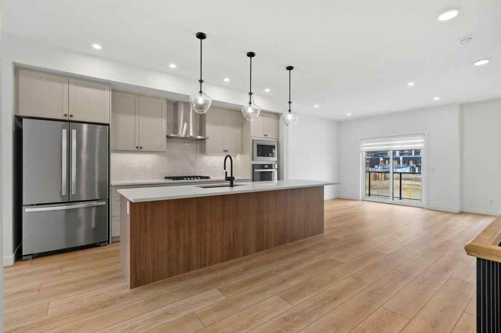 MLS® A2255576 - 8349 8 Avenue SW in West Springs Calgary, Residential