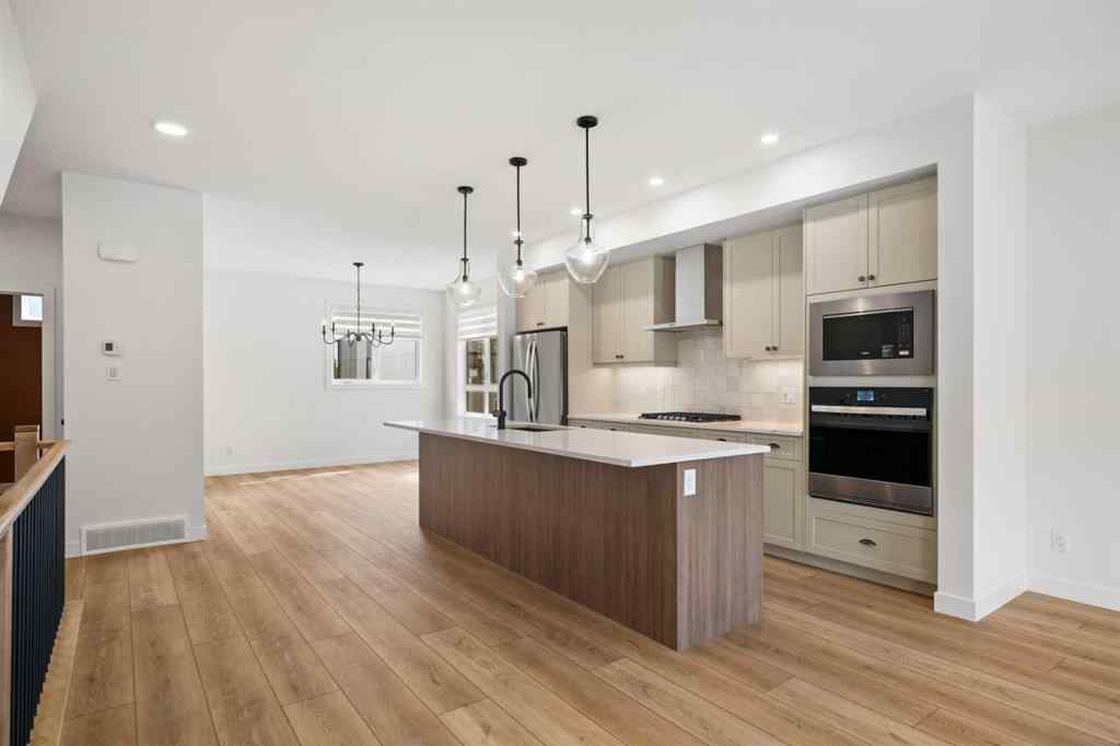 MLS® A2255576 - 8349 8 Avenue SW in West Springs Calgary, Residential