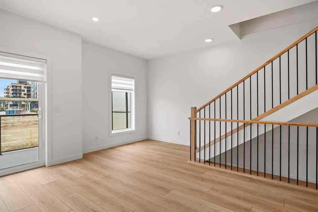 MLS® A2255576 - 8349 8 Avenue SW in West Springs Calgary, Residential