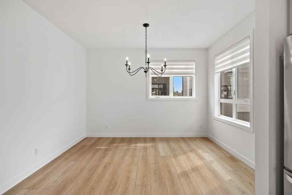 MLS® A2255576 - 8349 8 Avenue SW in West Springs Calgary, Residential