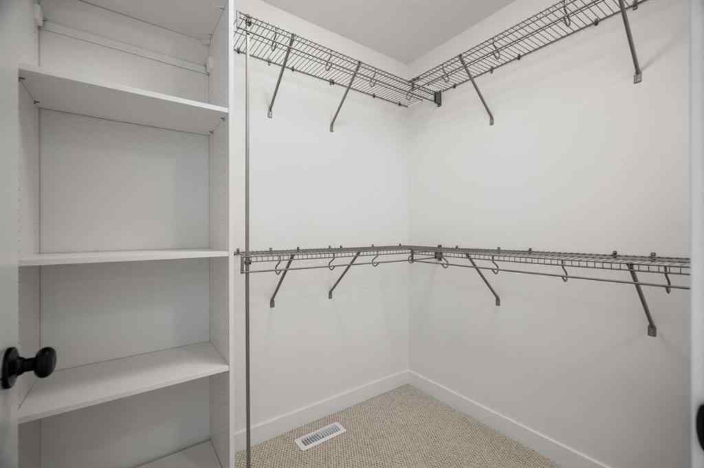 MLS® A2255576 - 8349 8 Avenue SW in West Springs Calgary, Residential