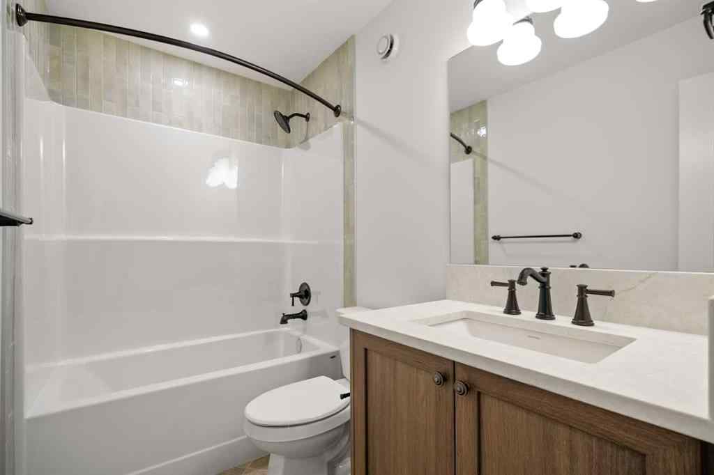 MLS® A2255576 - 8349 8 Avenue SW in West Springs Calgary, Residential