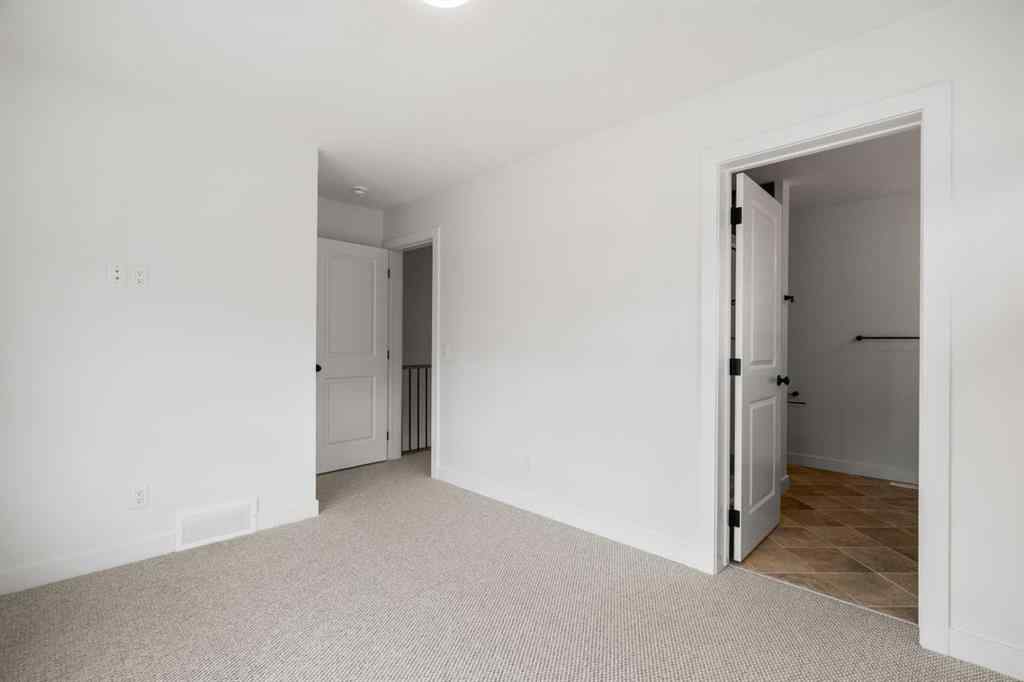MLS® A2255576 - 8349 8 Avenue SW in West Springs Calgary, Residential