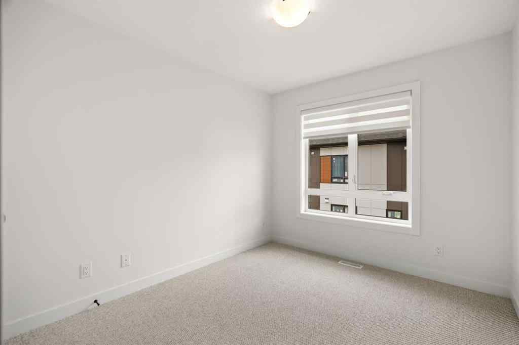 MLS® A2255576 - 8349 8 Avenue SW in West Springs Calgary, Residential