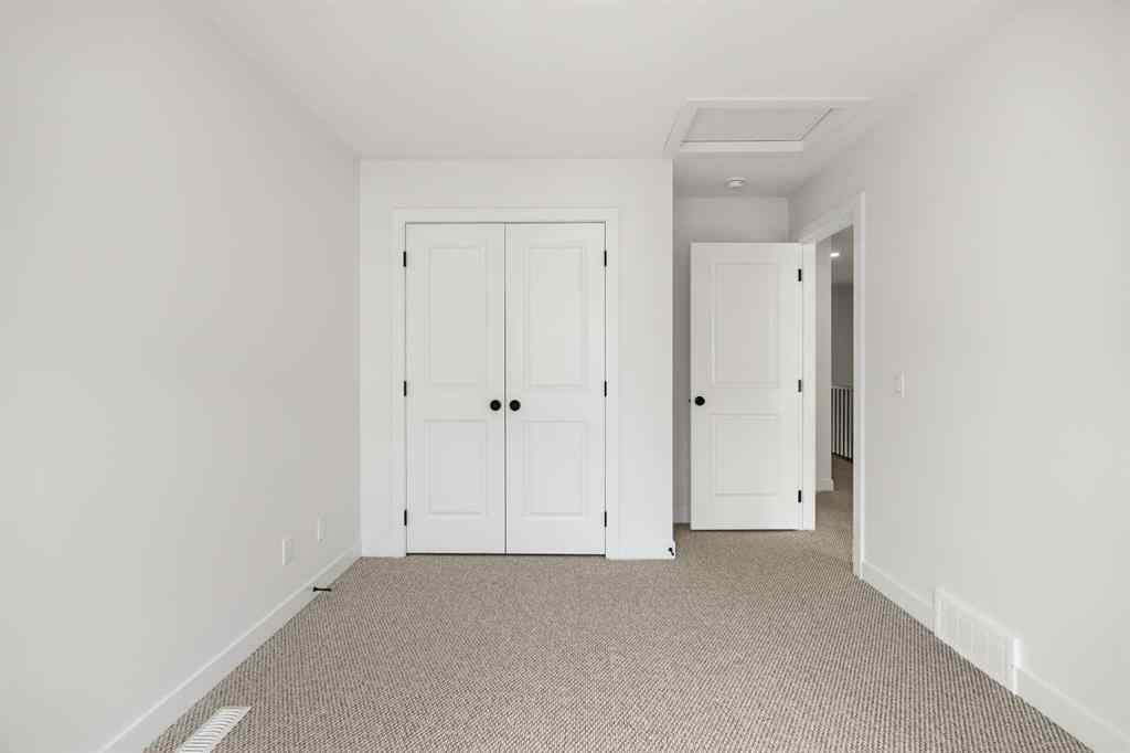 MLS® A2255576 - 8349 8 Avenue SW in West Springs Calgary, Residential