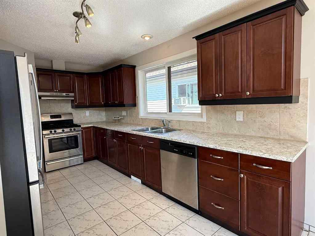MLS® A2255723 - 40 Millrise Drive SW in Millrise Calgary, Residential