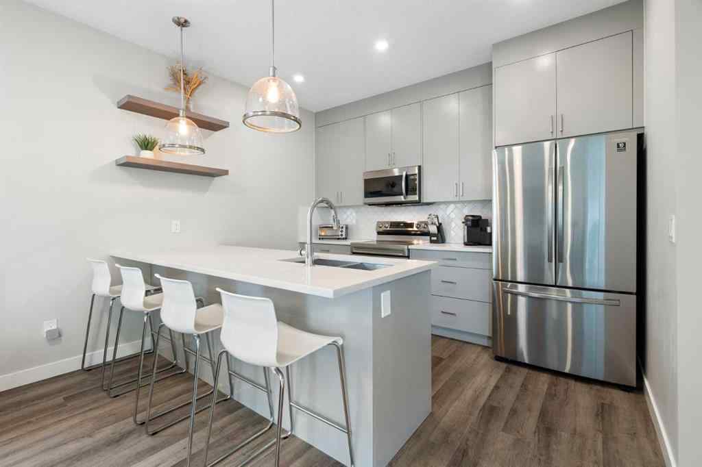 MLS® A2255878 - Unit #2 136 21 Avenue NE in Tuxedo Park Calgary, Residential