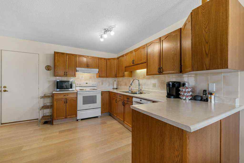 MLS® A2255899 - 83 Macewan Park Heights NW in MacEwan Glen Calgary, Residential