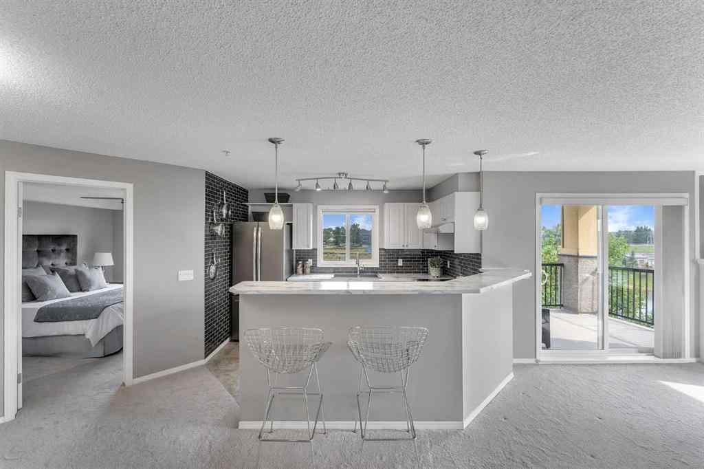 MLS® A2255909 - Unit #8328 304 Mackenzie Way SW in Downtown Airdrie, Residential