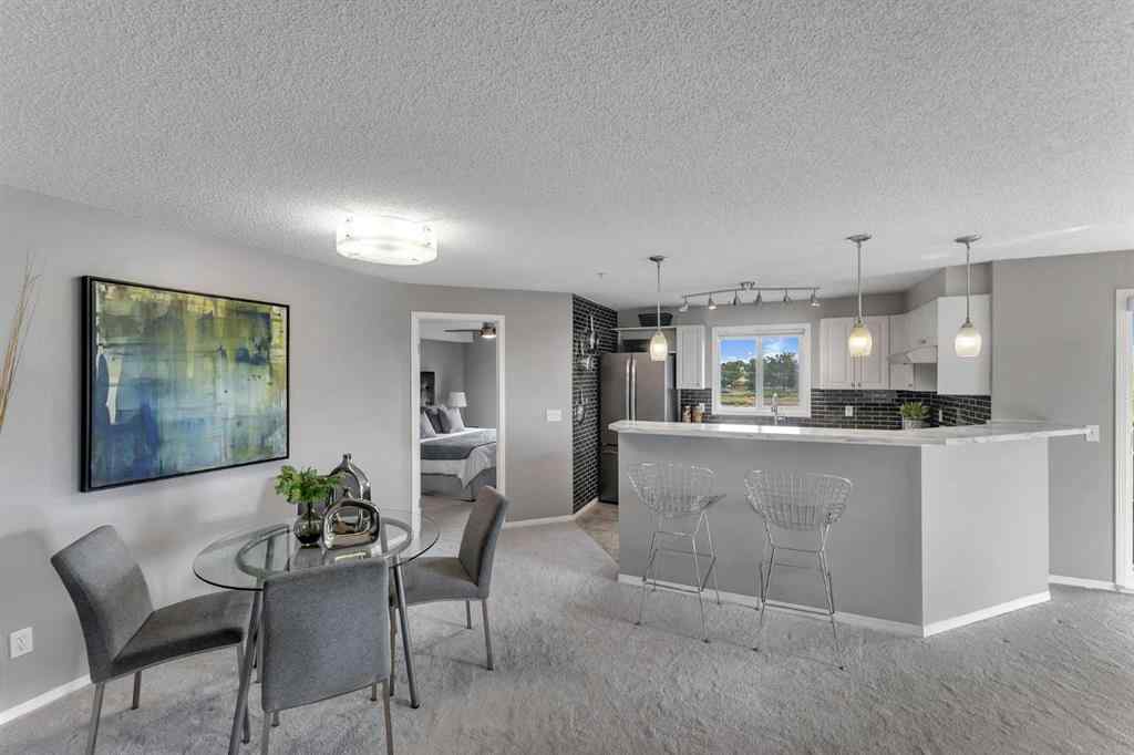MLS® A2255909 - Unit #8328 304 Mackenzie Way SW in Downtown Airdrie, Residential