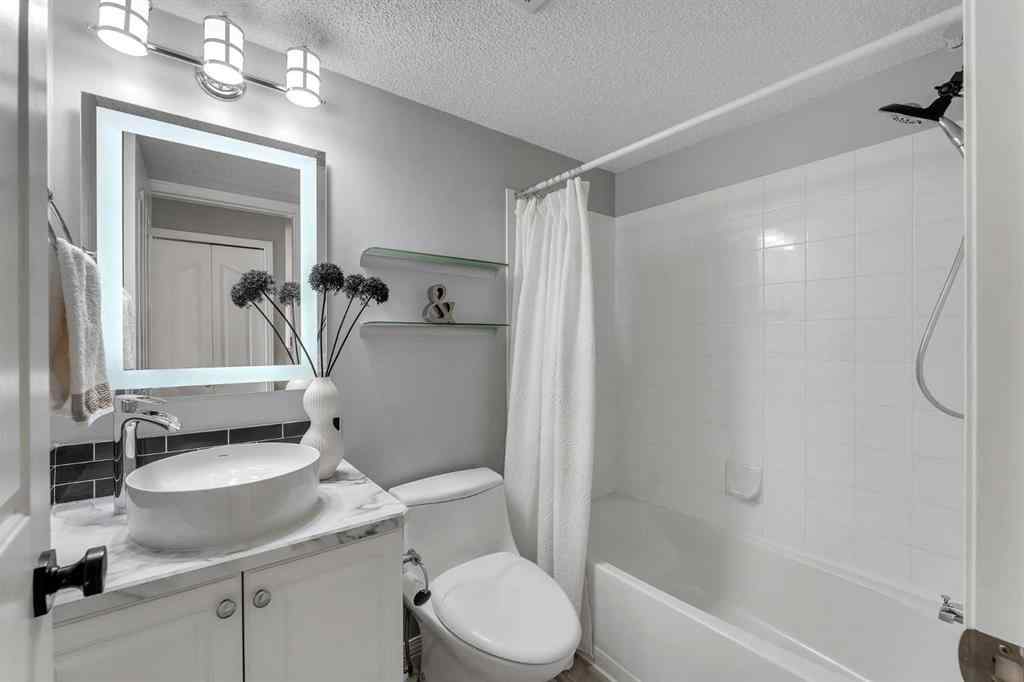 MLS® A2255909 - Unit #8328 304 Mackenzie Way SW in Downtown Airdrie, Residential