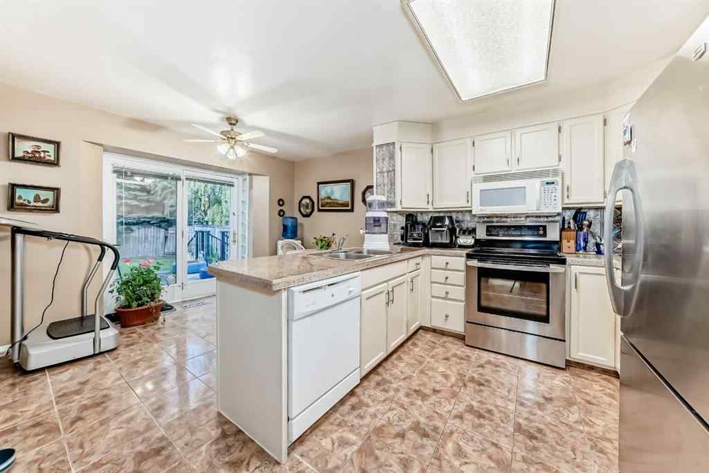 MLS® A2255928 - 983 Woodbine Boulevard SW in Woodbine Calgary, Residential