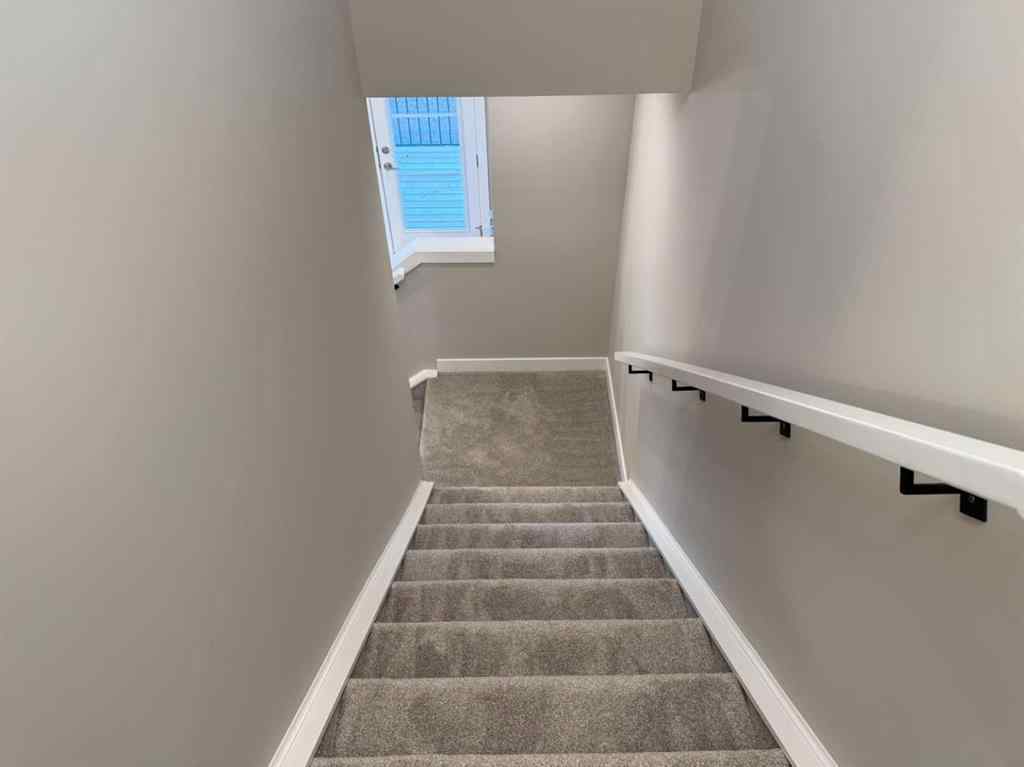 MLS® A2256036 - 302 Sundown Road  in Sunset Ridge Cochrane, Residential
