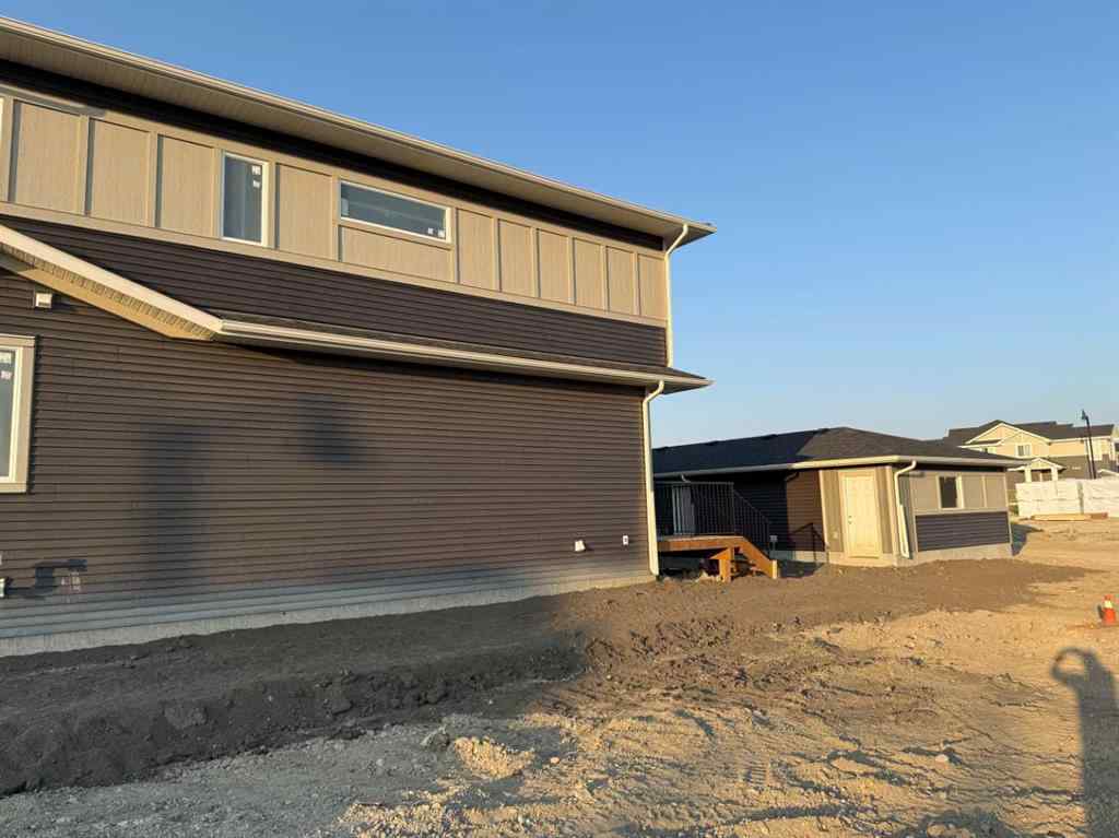 MLS® A2256036 - 302 Sundown Road  in Sunset Ridge Cochrane, Residential