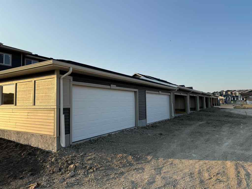MLS® A2256036 - 302 Sundown Road  in Sunset Ridge Cochrane, Residential