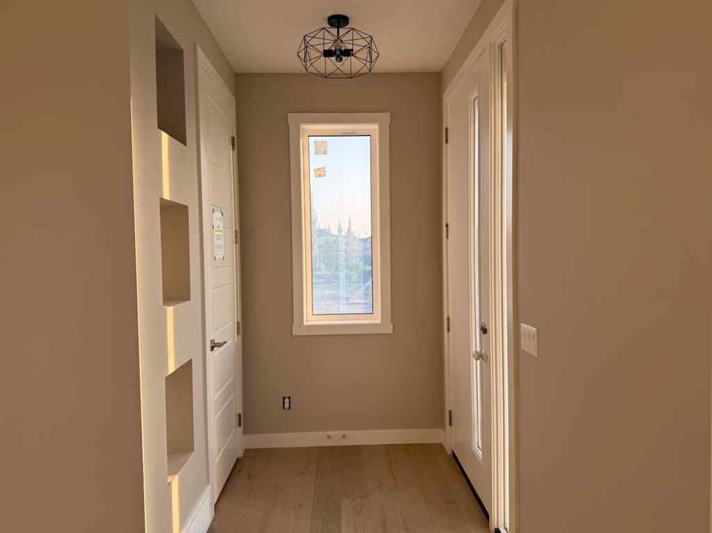 MLS® A2256036 - 302 Sundown Road  in Sunset Ridge Cochrane, Residential