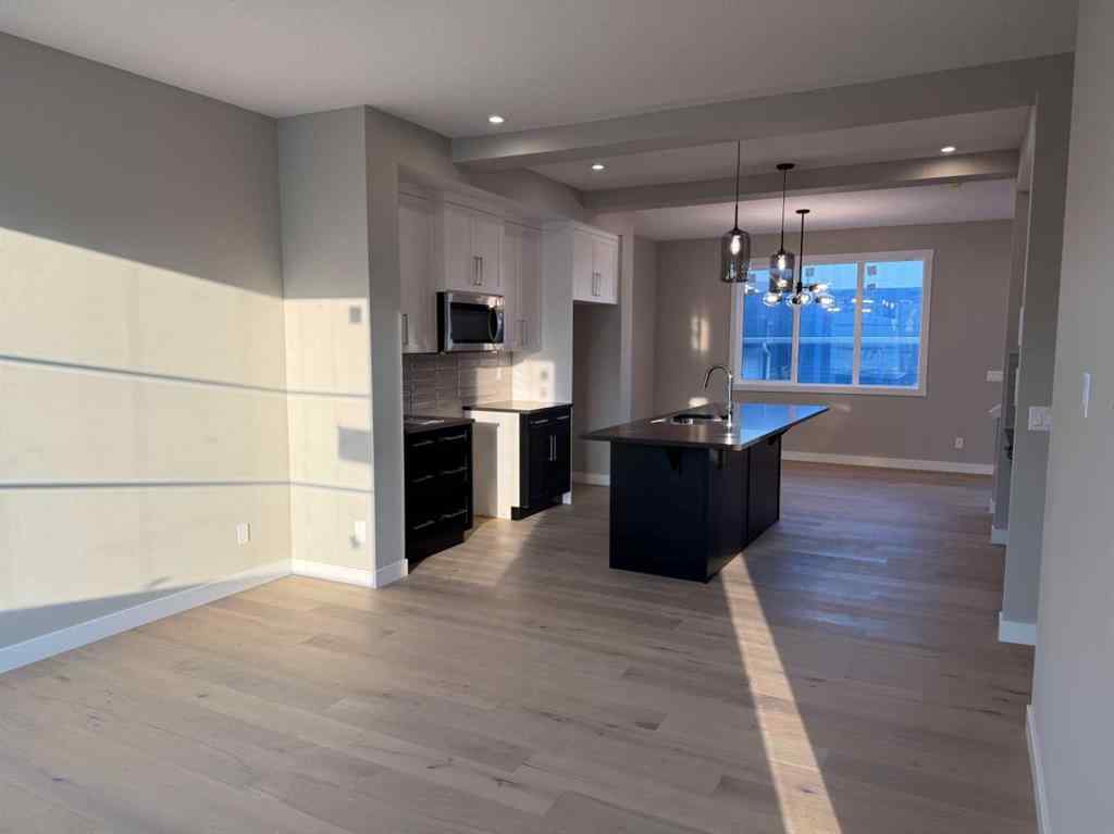 MLS® A2256036 - 302 Sundown Road  in Sunset Ridge Cochrane, Residential
