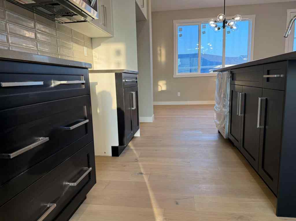 MLS® A2256036 - 302 Sundown Road  in Sunset Ridge Cochrane, Residential