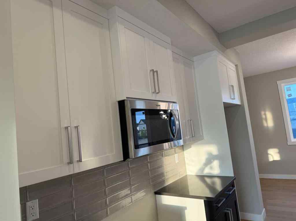 MLS® A2256036 - 302 Sundown Road  in Sunset Ridge Cochrane, Residential