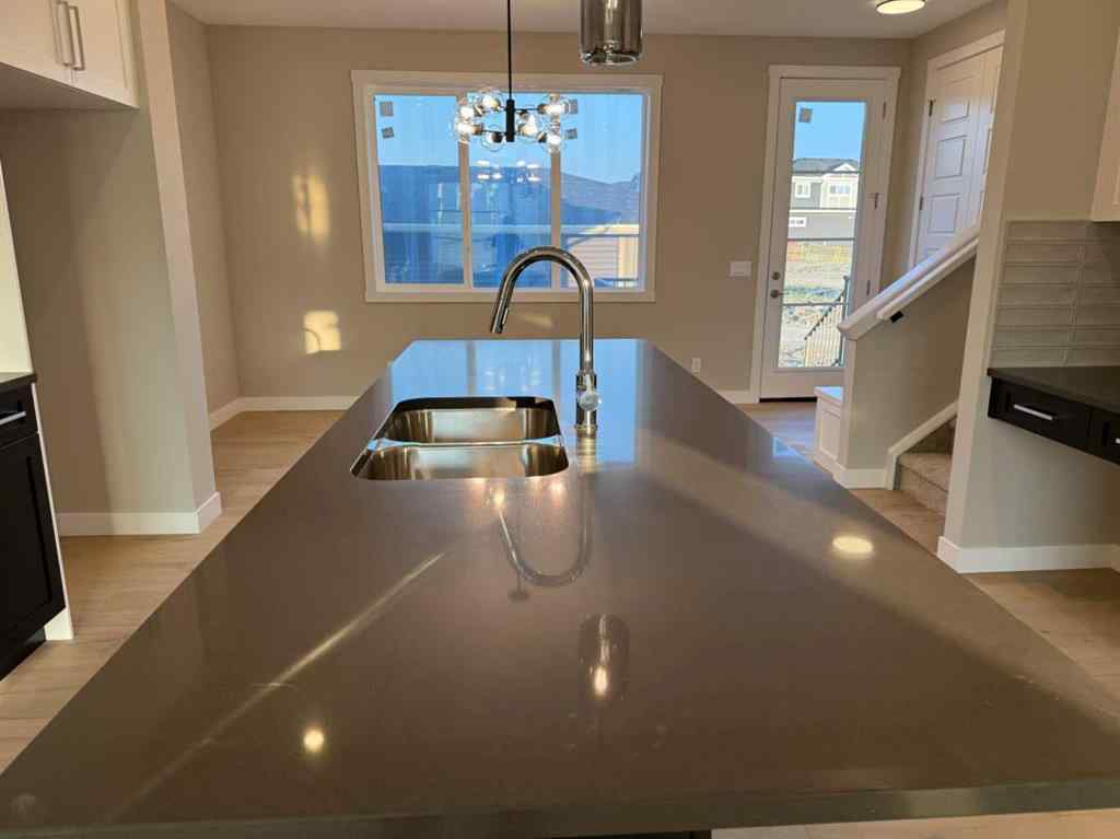 MLS® A2256036 - 302 Sundown Road  in Sunset Ridge Cochrane, Residential