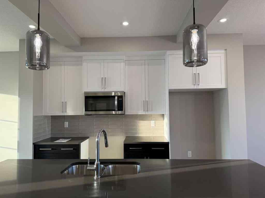 MLS® A2256036 - 302 Sundown Road  in Sunset Ridge Cochrane, Residential