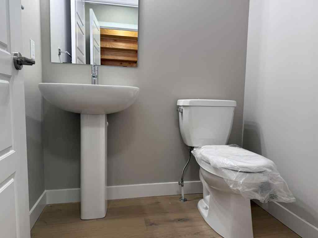 MLS® A2256036 - 302 Sundown Road  in Sunset Ridge Cochrane, Residential