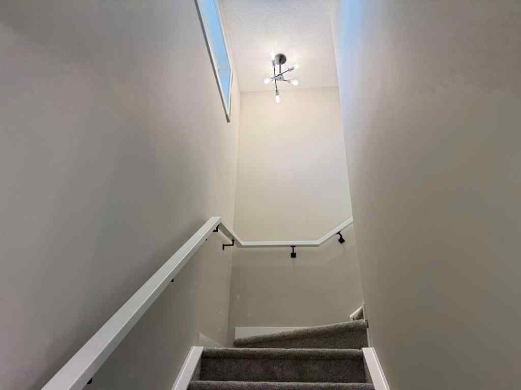 MLS® A2256036 - 302 Sundown Road  in Sunset Ridge Cochrane, Residential