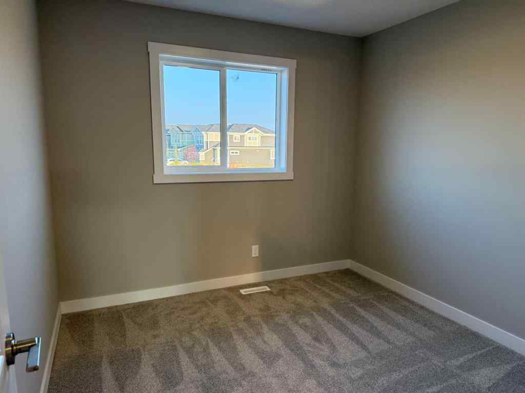 MLS® A2256036 - 302 Sundown Road  in Sunset Ridge Cochrane, Residential