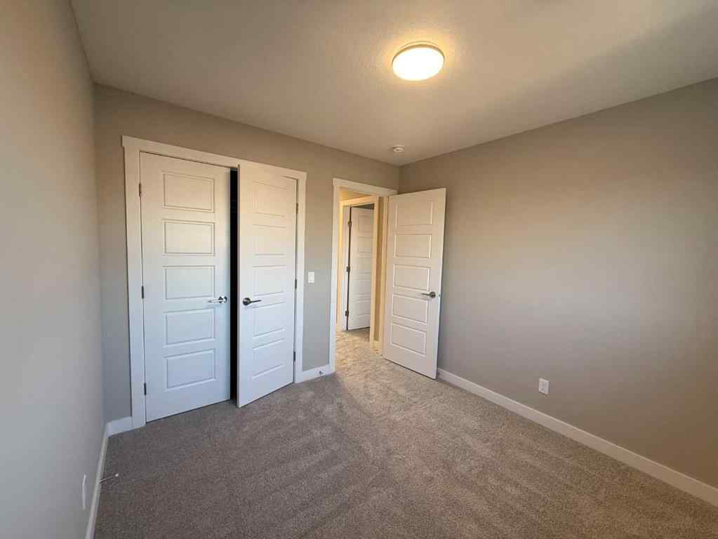 MLS® A2256036 - 302 Sundown Road  in Sunset Ridge Cochrane, Residential