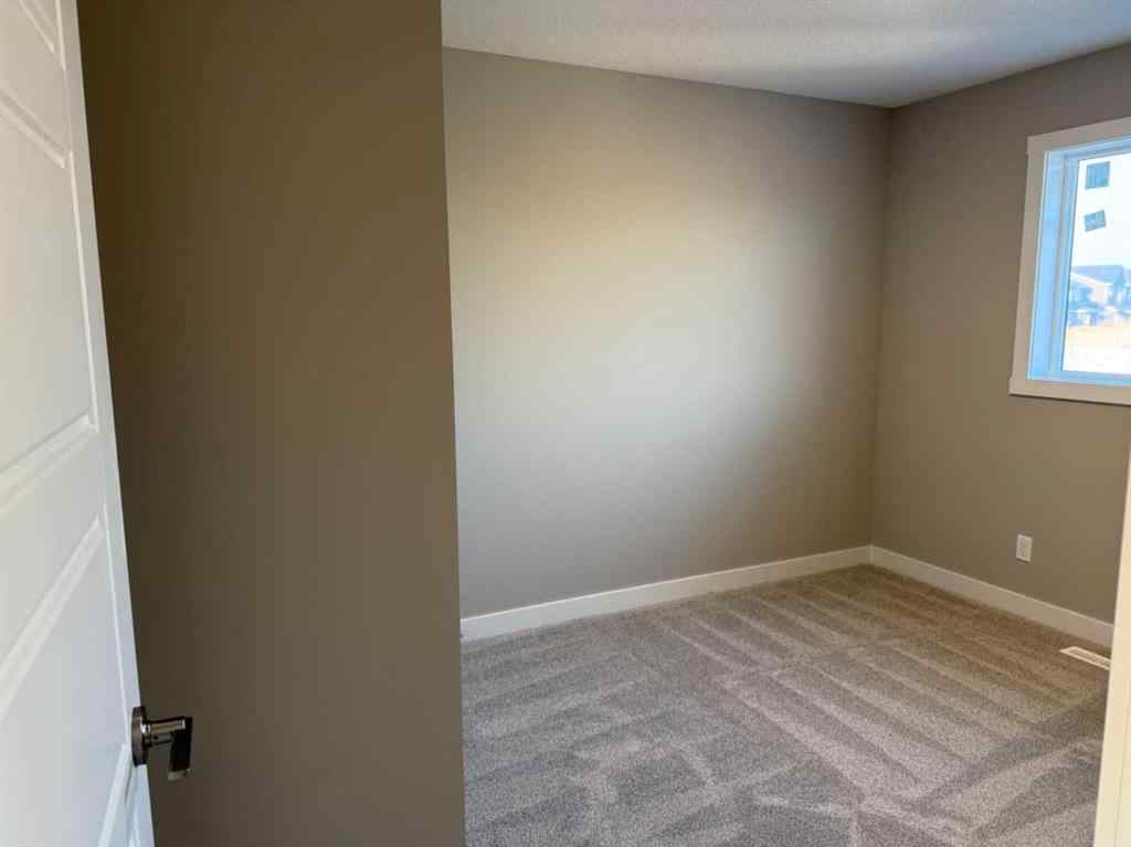 MLS® A2256036 - 302 Sundown Road  in Sunset Ridge Cochrane, Residential