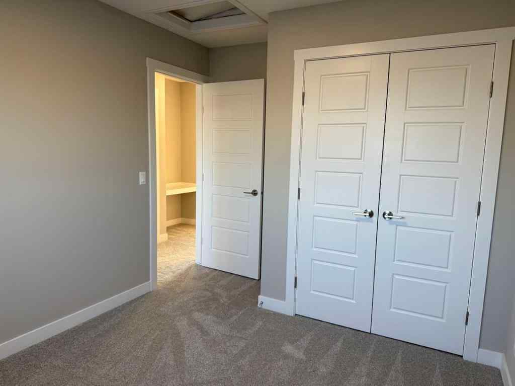 MLS® A2256036 - 302 Sundown Road  in Sunset Ridge Cochrane, Residential