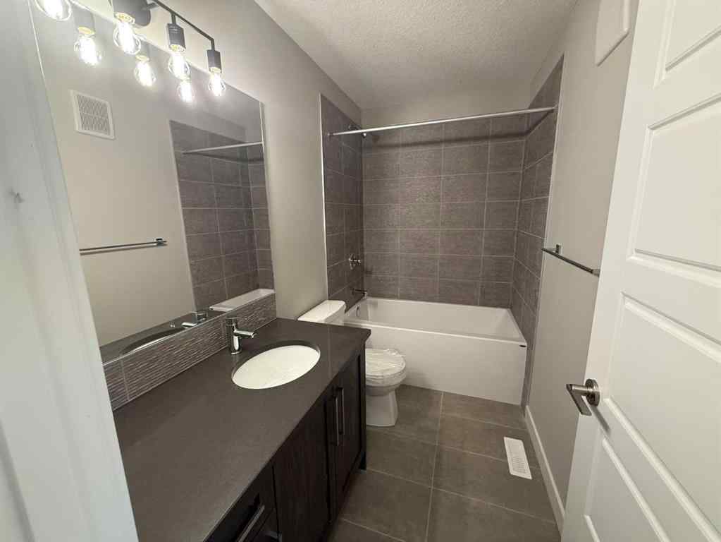 MLS® A2256036 - 302 Sundown Road  in Sunset Ridge Cochrane, Residential