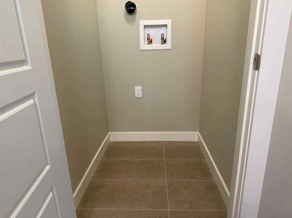 MLS® A2256036 - 302 Sundown Road  in Sunset Ridge Cochrane, Residential