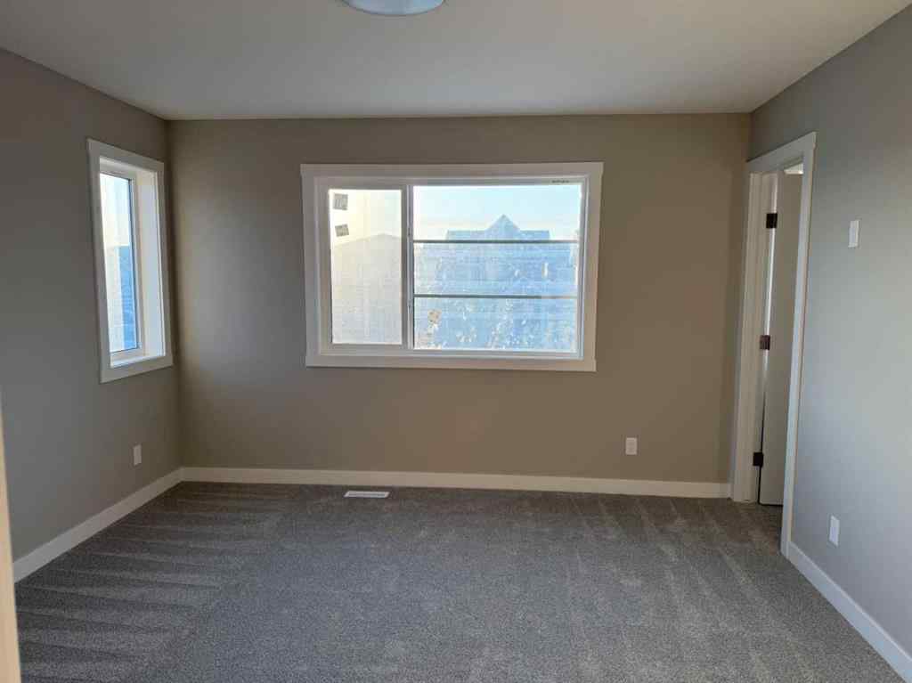 MLS® A2256036 - 302 Sundown Road  in Sunset Ridge Cochrane, Residential