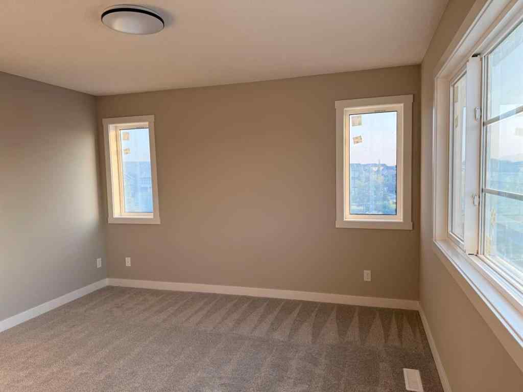 MLS® A2256036 - 302 Sundown Road  in Sunset Ridge Cochrane, Residential