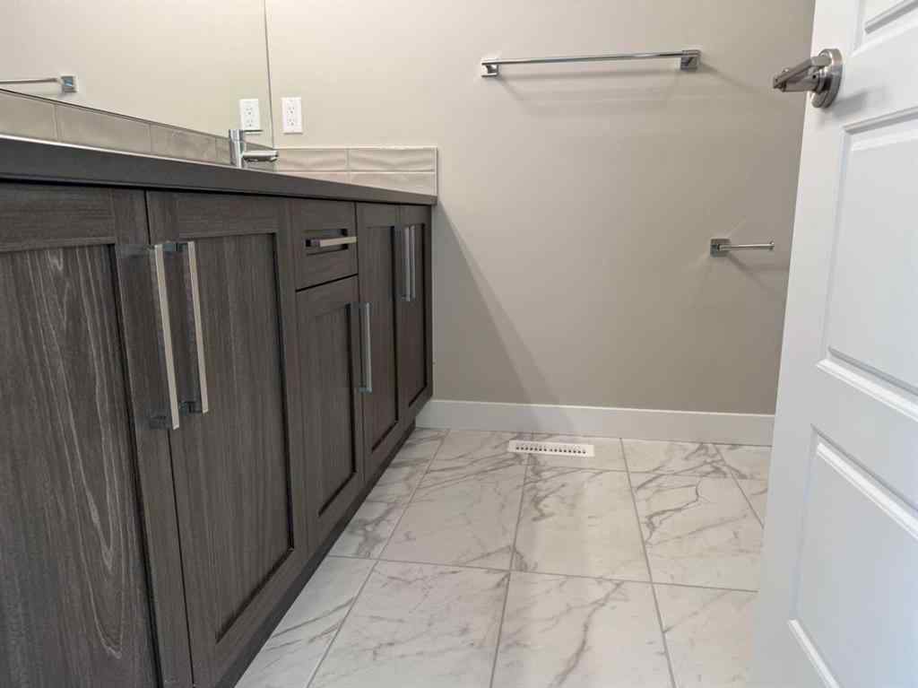 MLS® A2256036 - 302 Sundown Road  in Sunset Ridge Cochrane, Residential