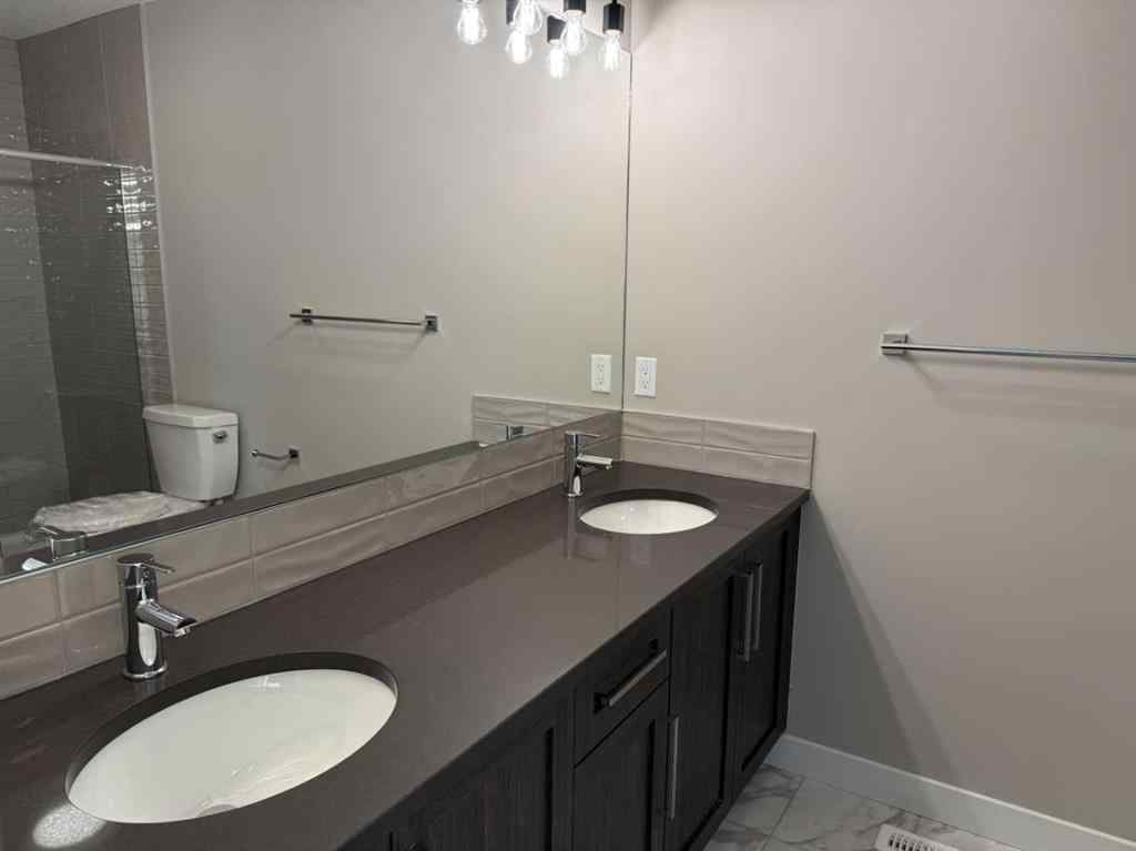 MLS® A2256036 - 302 Sundown Road  in Sunset Ridge Cochrane, Residential