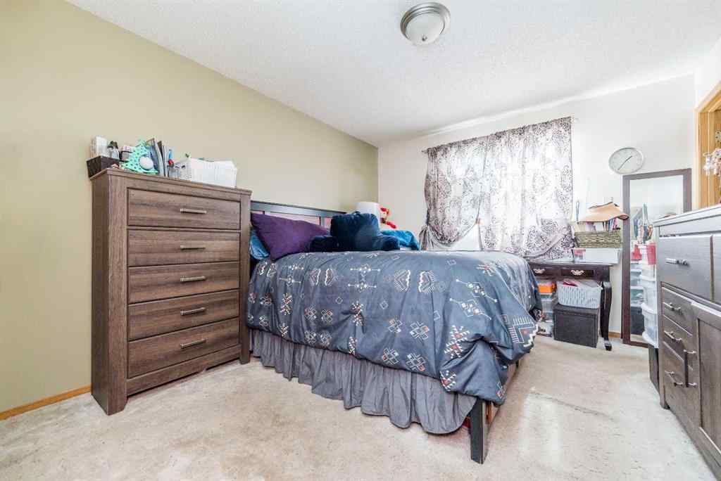 MLS® A2256108 - 9037 103 Avenue  in Ivy Lake Estates Grande Prairie, Residential