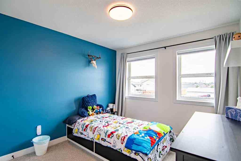 MLS® A2256122 - 587 Robinson Avenue  in Palisades Penhold, Residential