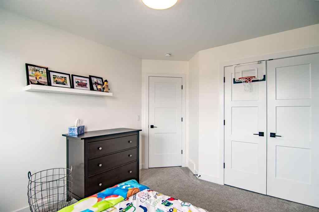 MLS® A2256122 - 587 Robinson Avenue  in Palisades Penhold, Residential
