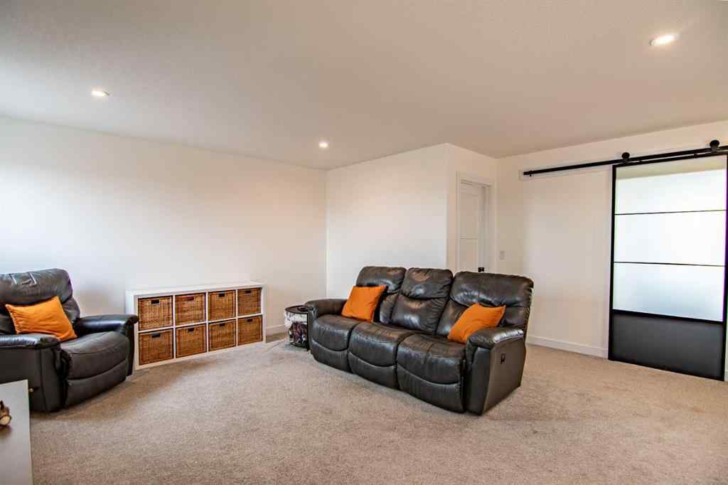MLS® A2256122 - 587 Robinson Avenue  in Palisades Penhold, Residential