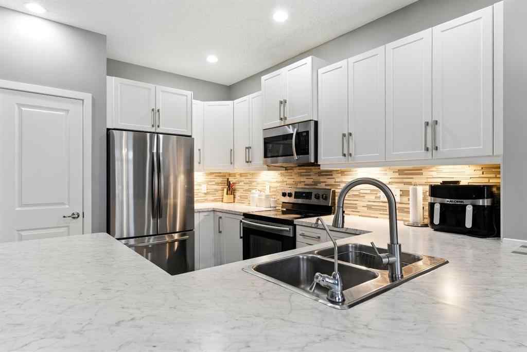 MLS® A2256123 - 313 Kings Heights Drive SE in Kings Heights Airdrie, Residential