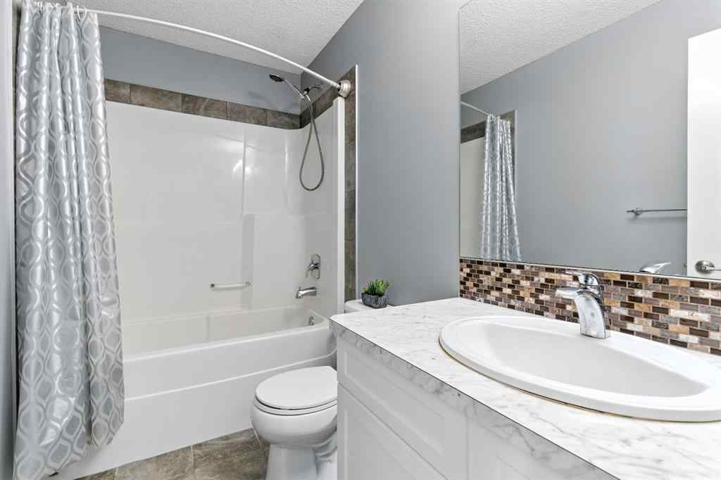 MLS® A2256123 - 313 Kings Heights Drive SE in Kings Heights Airdrie, Residential