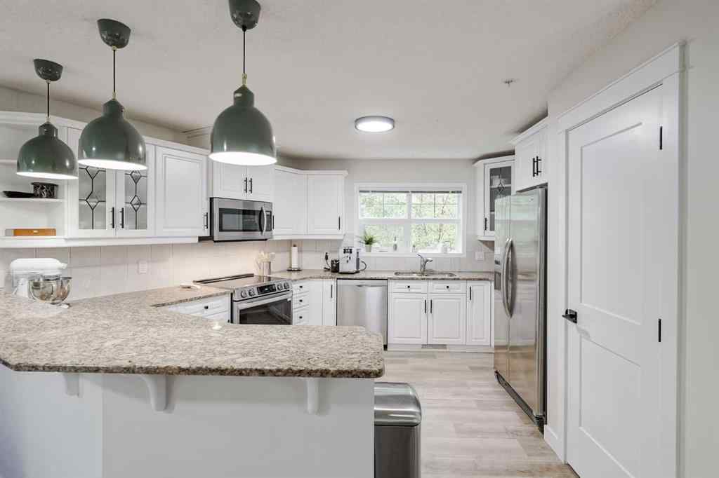 MLS® A2256132 - Unit #201 40 Parkridge View SE in Parkland Calgary, Residential