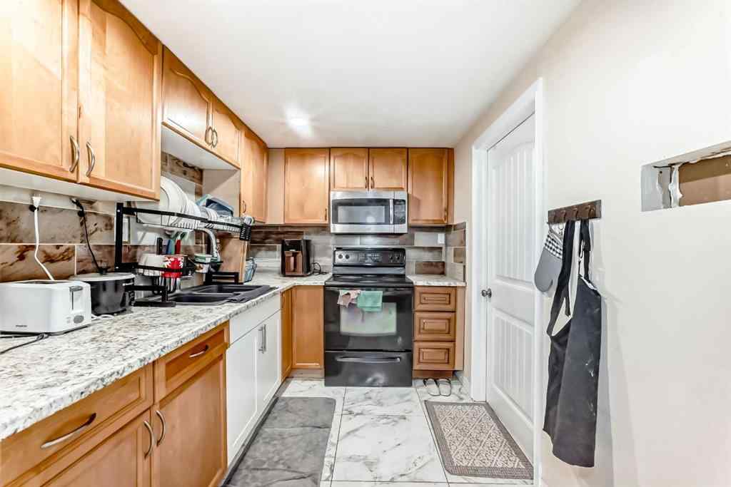 MLS® A2256139 - 203 Penbrooke Close SE in Penbrooke Meadows Calgary, Residential