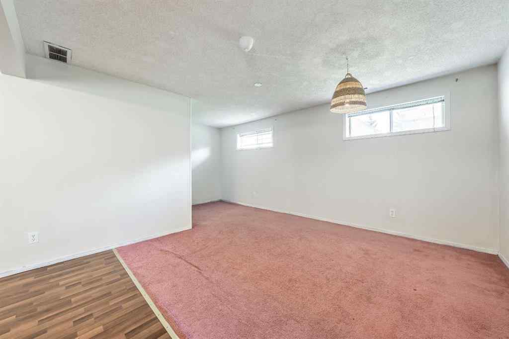 MLS® A2256226 - 680 Macewan Drive NW in MacEwan Glen Calgary, Residential