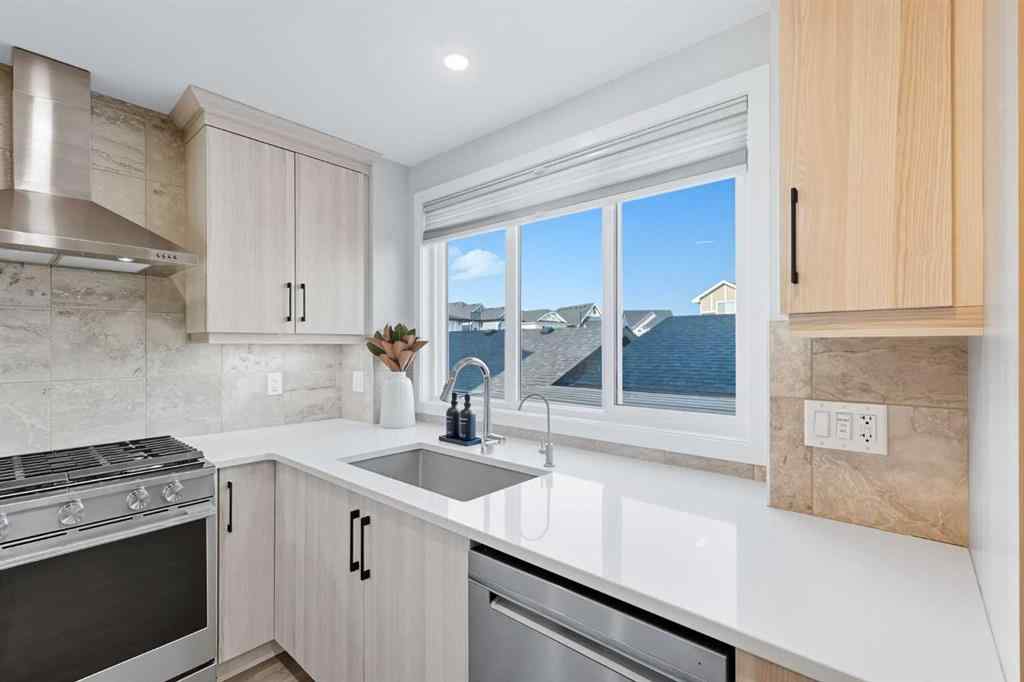 MLS® A2256351 - 305 Sundown Road  in Sunset Ridge Cochrane, Residential