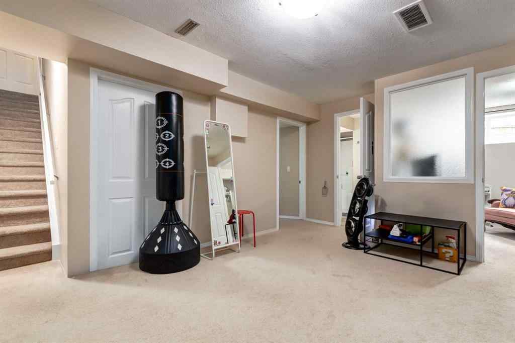 MLS® A2256377 - 82 Everglen Crescent SW in Evergreen Calgary, Residential