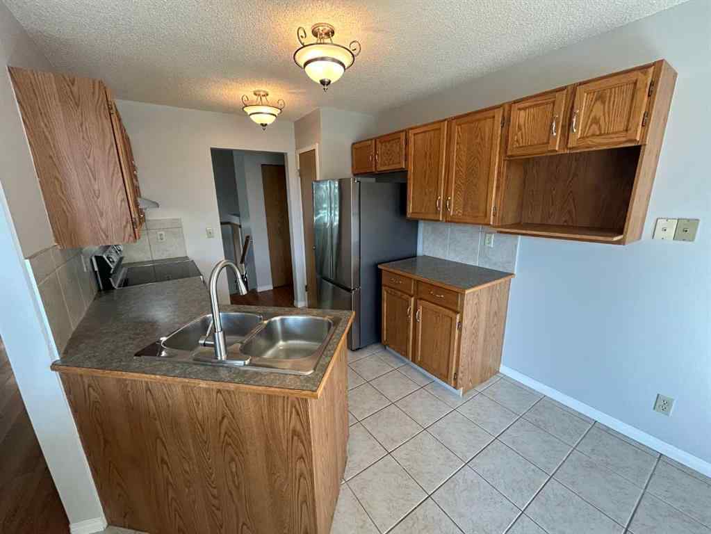 MLS® A2256408 - 28 Millrise Close SW in Millrise Calgary, Residential