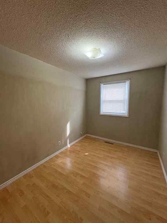 MLS® A2256420 - Unit #1-6 1608 38 Street SW in Rosscarrock Calgary, Multi-Family